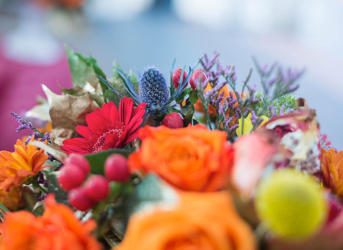 A lovely bouquet featuring bright oranges and reds